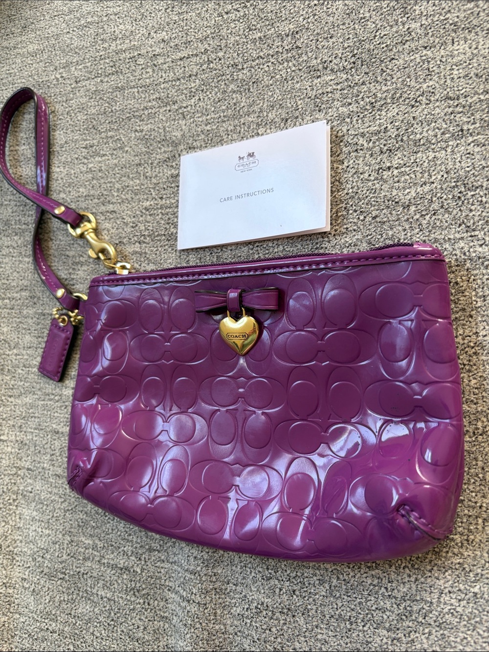 Coach Patent Signature Wristlet in Plum with Gold Heart Charm